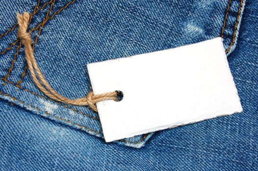 blank price tag with copyspace on a jeans texture