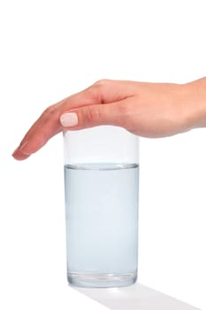 Glass with water covered by Hand