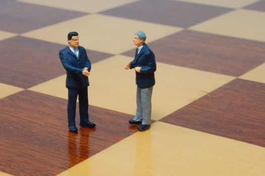 group uf business people standing on a chess board