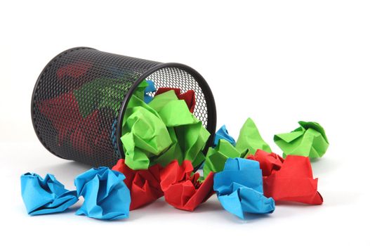 messy office with trash basket and paper isolated on white background