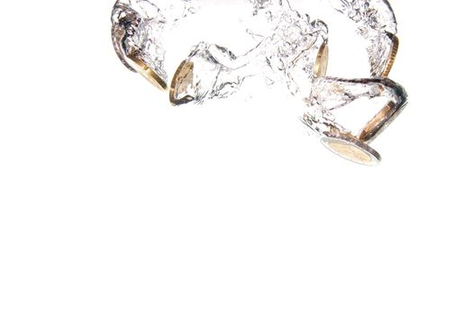 money in water with bubbles on white background