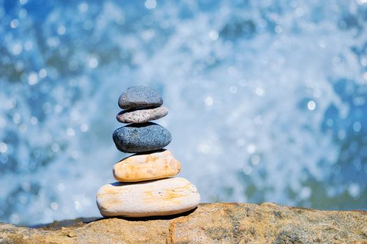 Pile of pebble on the background of water drops