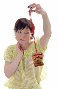 Woman with wooden toy heart in her hands 