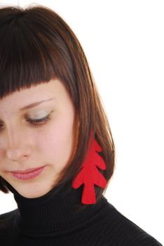 Young woman with new year tree as ear ring