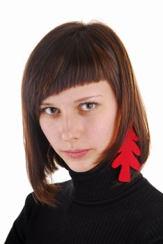 Young woman with new year tree as ear ring