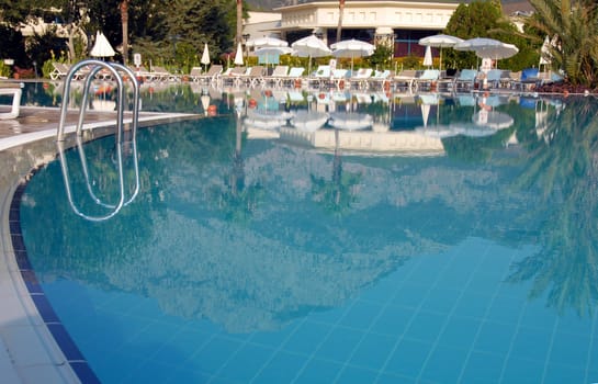 swimming pool at mediterranean summer resort hotel in Turkey