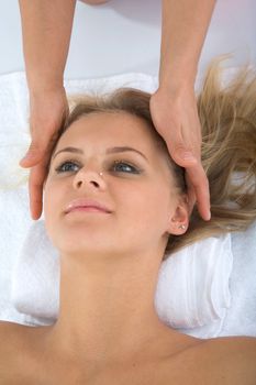masseuse does relax facial massage to the girl