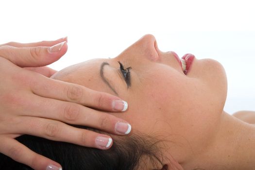 masseuse does relax facial massage to the girl