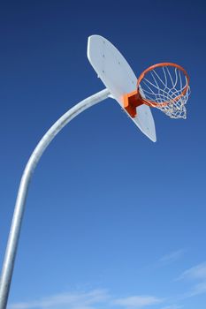 New basketball backboard and clear sky. Perfect day for playing basketball.