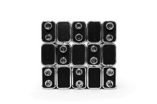 Nine volt batteries forming a square, on white background.