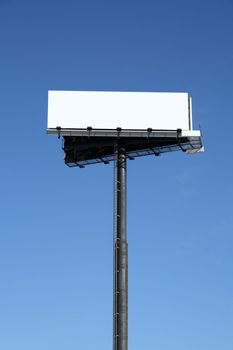 Blank billboard with copy space against the blue sky.