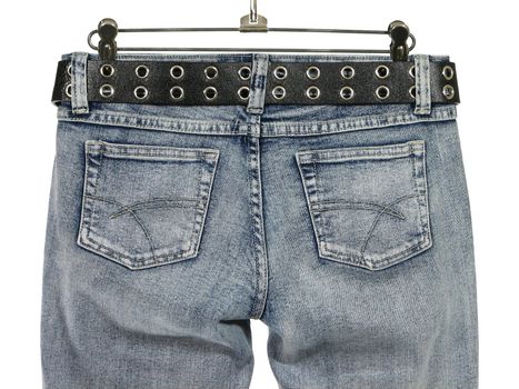 Closeup of blue jeans with pockets and black leather belt, rear view. Isolated on white.