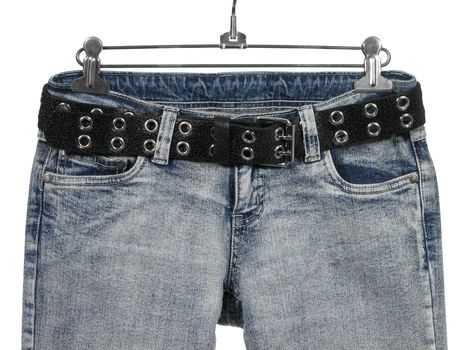 Closeup of blue jeans / shirts with pockets and black leather belt. Isolated on white.