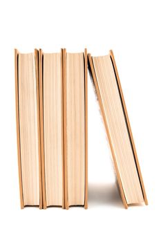 Four hardcover books isolated on white background.