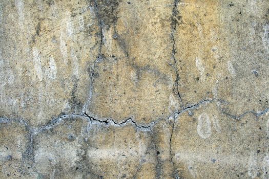 Grunge urban background: cracked and damaged concrete wall