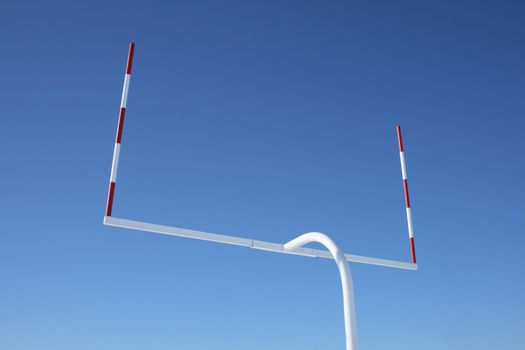 Uprights of American football goal posts against the blue sky.