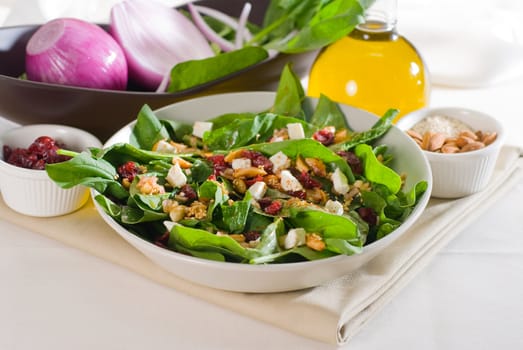 plate of fresh colorfull spinach salad close up