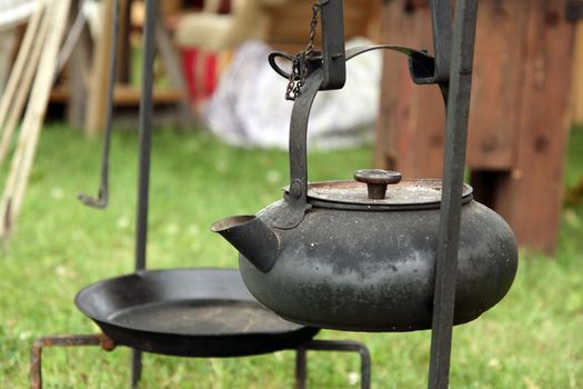 Black antique cast-iron kettle.