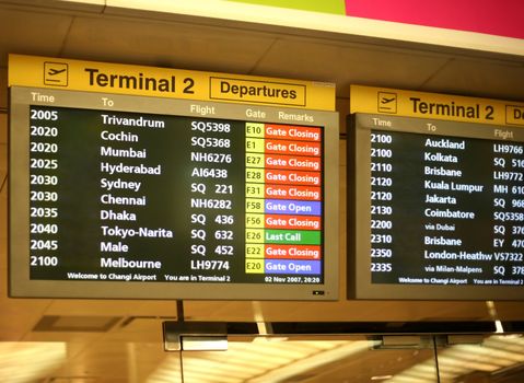Flight announcement shows time of departure on a screen