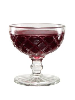 Sweet red jelly dessert in an old fashioned glass bowl.