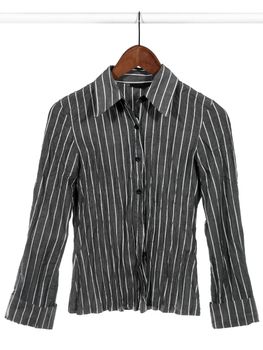 Stylish gray striped shirt on wooden hanger, isolated on white.