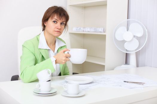 The woman with very big cup in the hand