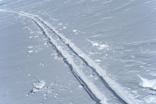 Winter sport. Ski tracks in the snow.