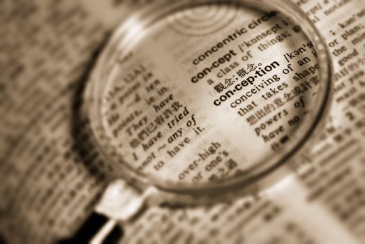 Looking for conception with magnifier on book (yellow color)