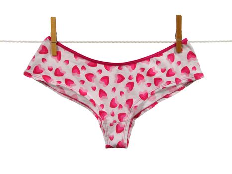 Valentine panties hanging on a clothes-line, isolated on white background. Contains clipping path.