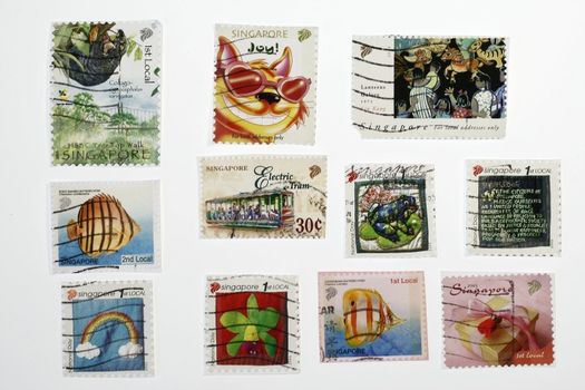 set of similar old postage stamps from singapore