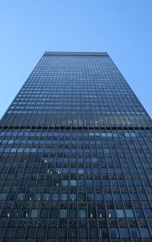 High-rise rectangular building, view from below.