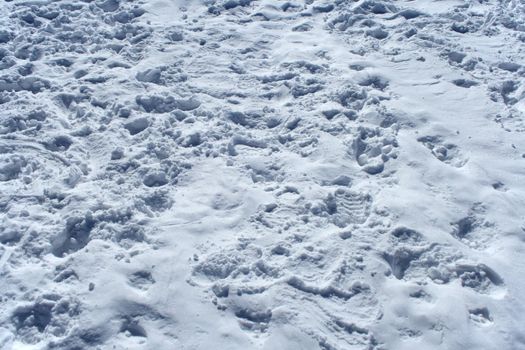 Background � many footprints in the snow.
