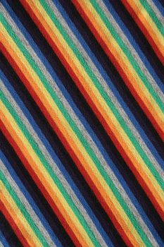 Colorful striped fabric background. Diagonal stripes.