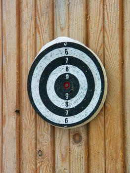 The image of a target on a wooden wall