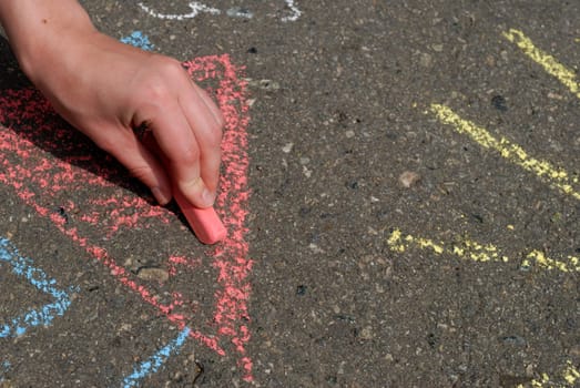 chalk in hand, drawing