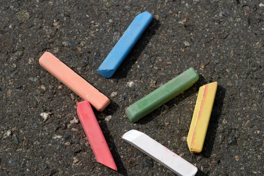color crayon at asphalt