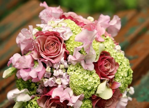Wedding bouquet from roses on a dim background