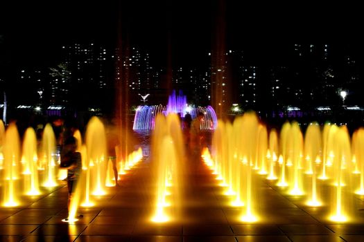 3 series of Fountain at Night with buildings lit at the background