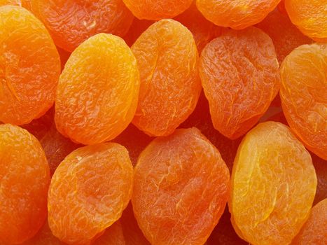 Close up of bright orange dried apricots.