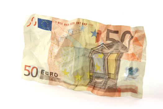 crumpled fifty euro banknote isolated on white background