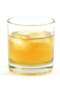 one glass with whiskey on the rocks isolated on white background