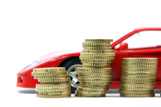 coins and sports red car blur in background isolated business and finance