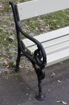 close-up of a wooden bench in a park