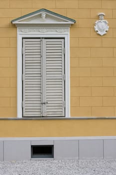 old baroque window and peach wall