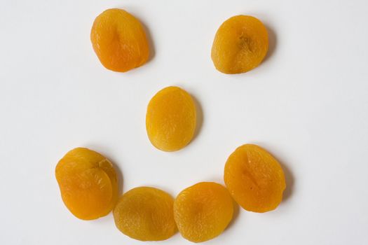 happy face made of dried apricots