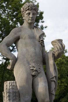monument of a young naked man with a curly hair