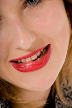 Smile of a beautiful young woman on white background