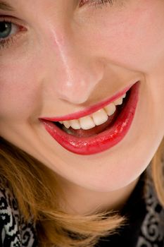 Smile of a beautiful young woman on white background
