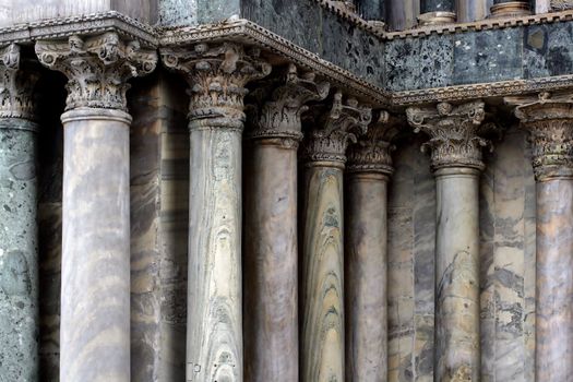 A series of marble columns in Venice Italy.
