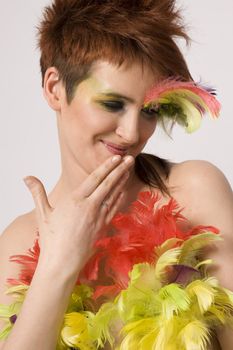 fashion model with feather on face